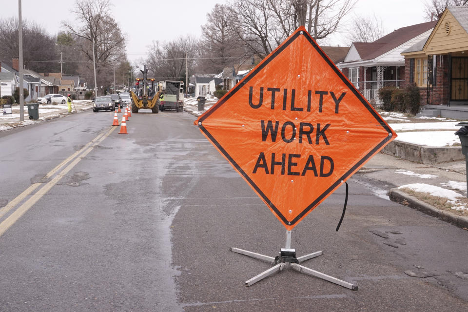 Memphis Light Gas & Water makes repairs to a broken water main in north Memphis, Tenn., Monday, Jan. 22, 2024. Memphis and the the surrounding area has endured a week of sub-freezing temperatures, snow and ice. (AP Photo/Karen Pulfer Focht)