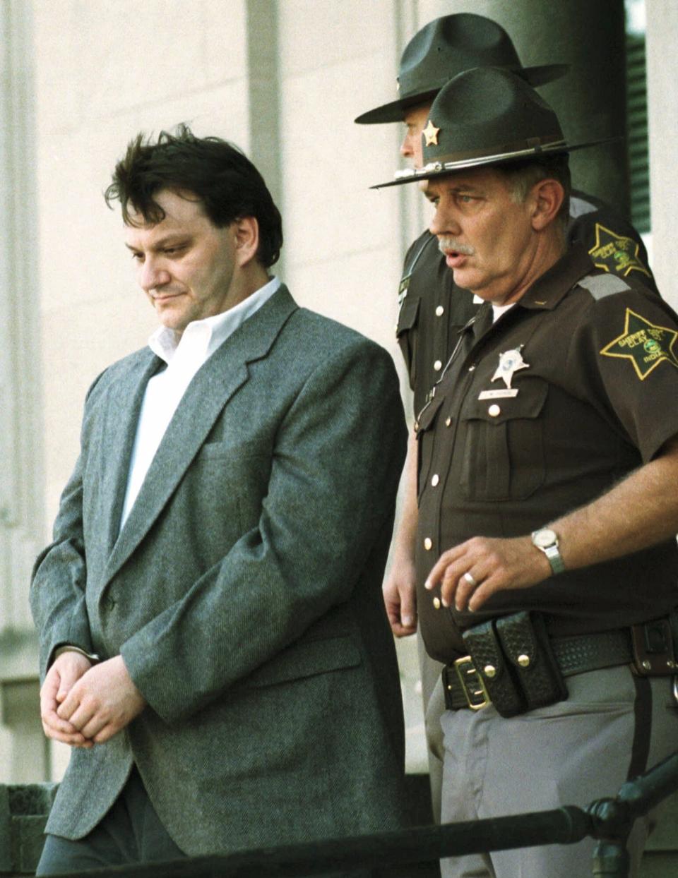 Orville Lynn Majors left leaves the Clay County courthouse in Brazil Ind. Sunday Oct. 17 1999 after a jury convicted the former nurse of killing six patients at Vermillion County Hospital in the mid-1990s. The jury could not decide on the seventh patient he was charged with injecting lethal doses of potassium chloride while he was a practical nurse at the rural hospital. Majors could be sentensed to 65 years for each of the six murders. (AP Photo/Chuck Robinson)