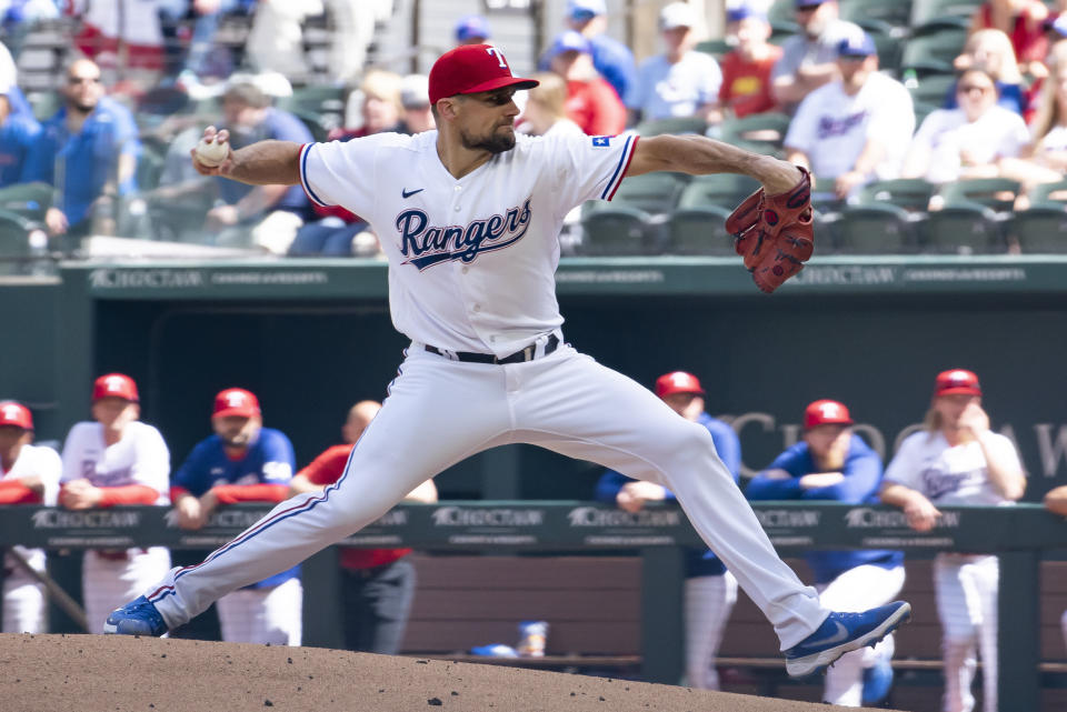 Texas Rangers starting pitcher Nathan Eovaldi delivers during the top of the first inning in a baseball game against the Philadelphia Phillies in Arlington, Texas, Saturday, April 1, 2023. (AP Photo/Emil T. Lippe)