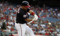 Washington Nationals' Ryan Zimmerman hits an RBI single during the first inning of the team's baseball game against the New York Mets at Nationals Park, Tuesday, July 31, 2018, in Washington. It was Zimmerman's 1,695th hit, a new franchise record. (AP Photo/Alex Brandon)