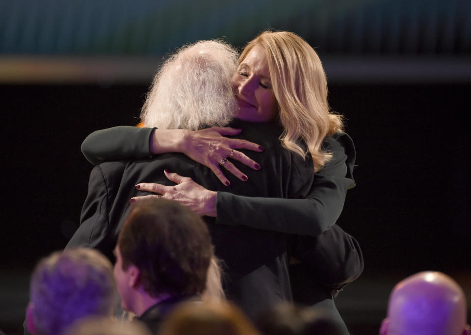 Laura Dern, right, hugs Bruce Dern before going on stage to accept the award for outstanding performance by a female actor in a supporting role for "Marriage Story" at the 26th annual Screen Actors Guild Awards at the Shrine Auditorium & Expo Hall on Sunday, Jan. 19, 2020, in Los Angeles. (Photo/Chris Pizzello)