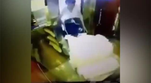 Footage shows the lift slamming shut before the cleaner was properly inside, nearly trapping her between its doors. Picture: LiveLeak/AnT00ni0