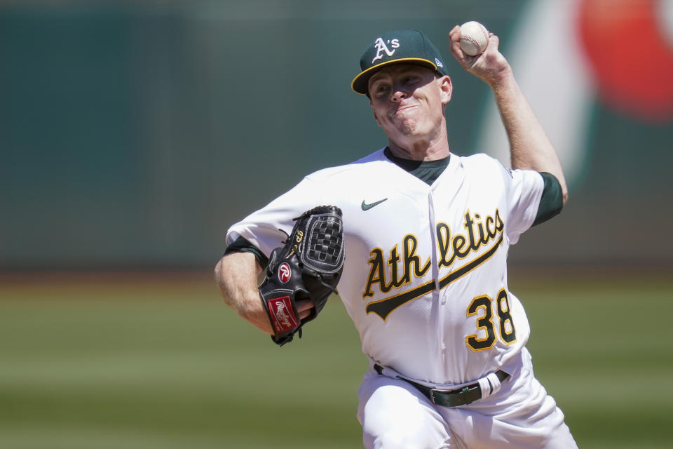 Oakland Athletics' JP Sears pitches against the Seattle Mariners during the first inning of a baseball game in Oakland, Calif., Sunday, Aug. 21, 2022. (AP Photo/Godofredo A. Vásquez)