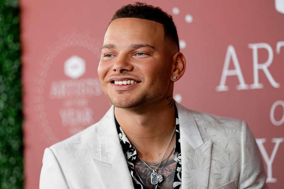 <p>Jason Kempin/Getty</p> Kane Brown attends the 2021 CMT Artist of the Year on October 13, 2021 in Nashville, Tennessee.