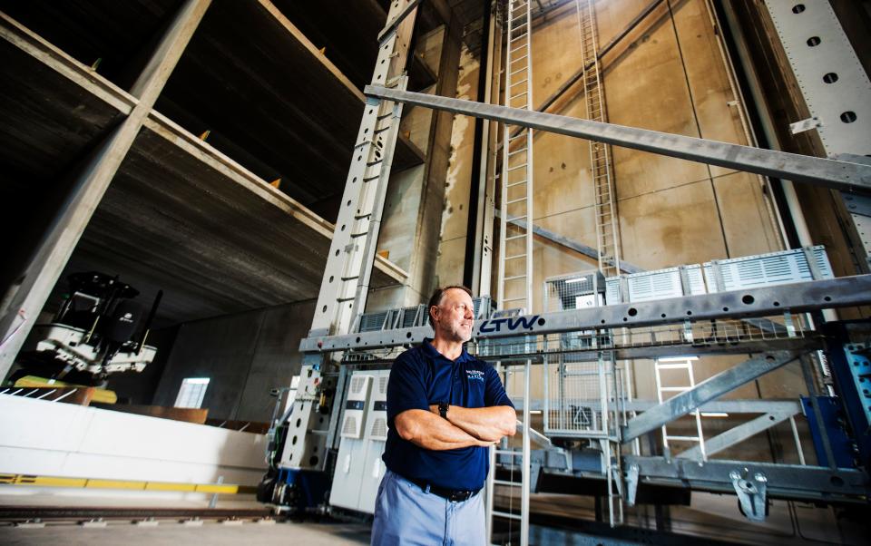 Todd Carroll, one of the owners of Gulf Star Marina on San Carlos Island on Fort Myers Beach, stands in front of the automatic storage retrieval system at the new marina.