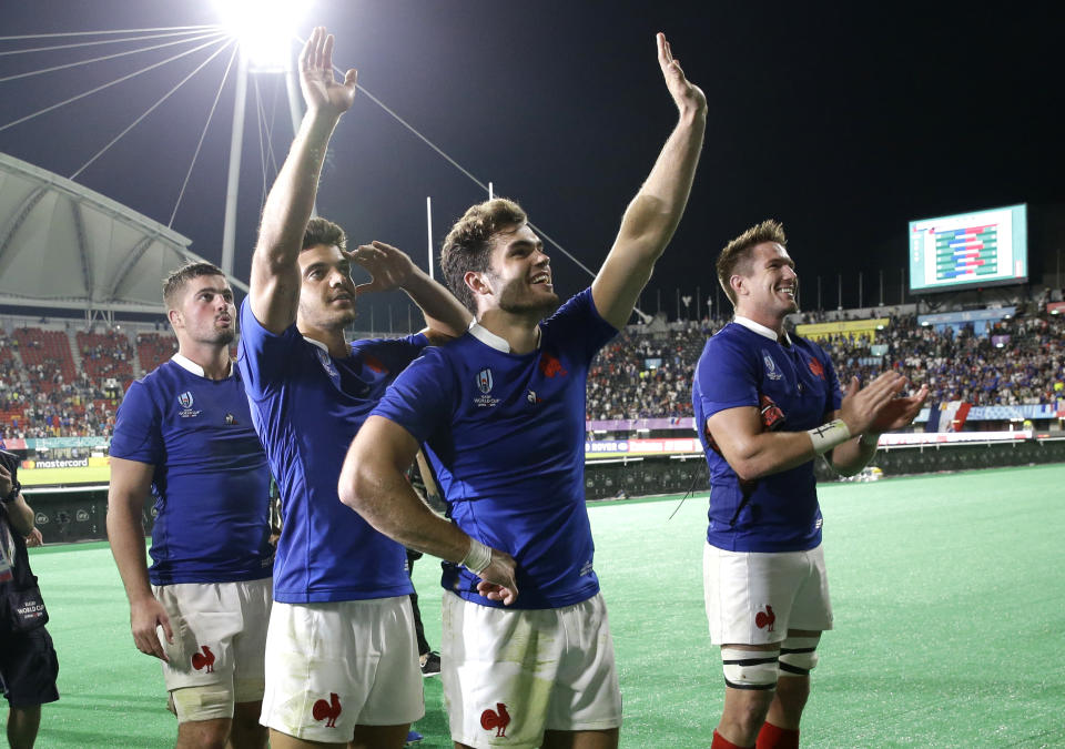 French players celebrate after their Rugby World Cup Pool C game at Kumamoto Stadium against Tonga in Kumamoto, Japan, Sunday, Oct. 6, 2019. (AP Photo/Aaron Favila)