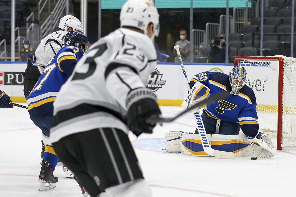 St. Louis Blues goaltender Jordan Binnington (50) stops a shot during the first period of the team's NHL hockey game against the Los Angeles Kings on Wednesday Feb. 24, 2021, in St. Louis. (AP Photo/Scott Kane)