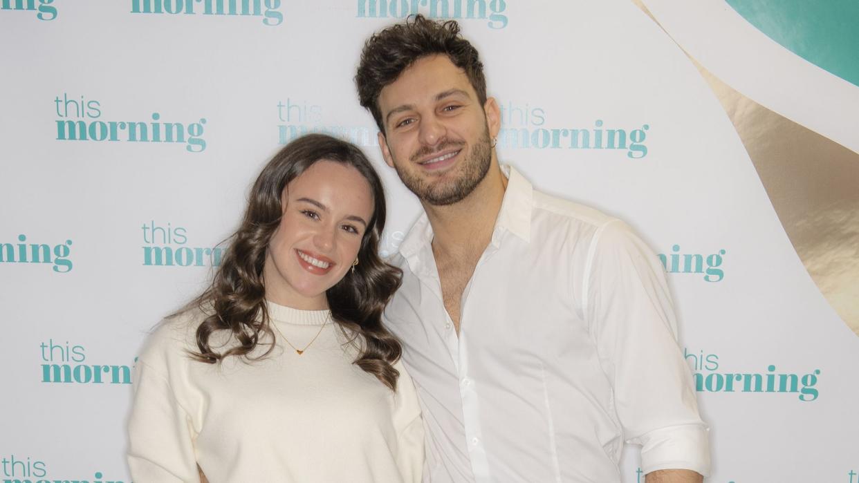 Ellie Leach in a white dress with Vito Coppola in white shirt and grey trousers