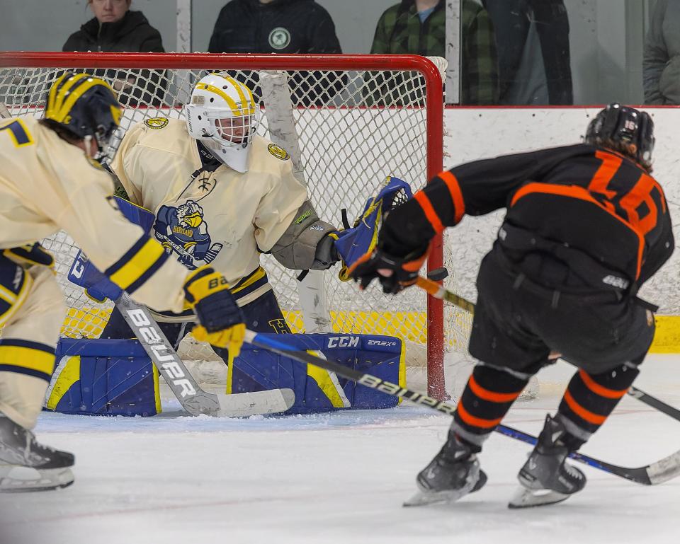 Hartland goalie Gaige Dieugenio makes one of his 16 saves on a shot by Brighton's Cam Duffany Saturday, Dec. 16, 2023.