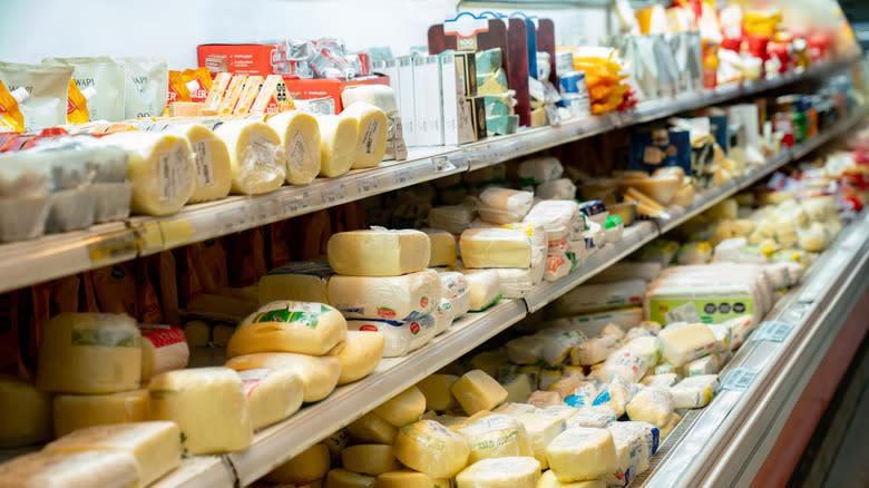 variety of cheeses in supermarket