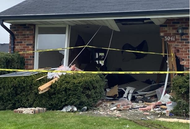 PHOTOS: Car crashes into Springfield living room