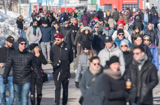 Warm, sunny weather drew droves of people to Montreal's Old Port on Sunday. According to Quebec Public Health, transmission of COVID-19 outdoors is possible.