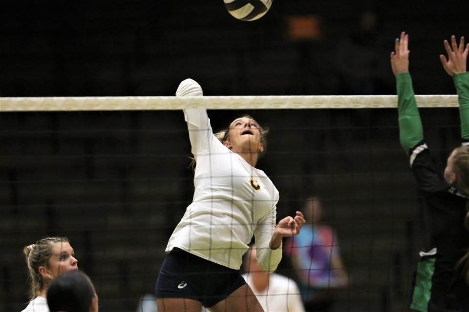Delta volleyball's Kendra Keesling goes for a kill in the team's sectional first round match against New Castle at New Castle High School on Thursday, Oct. 13, 2022.