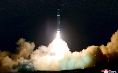 North Korean launching of the Hwasong-15 missile which is capable of reaching all parts of the US in November 2017 - Credit: AFP/ KCNA VIA KNS