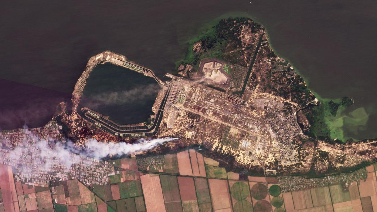This composite of satellite images taken by Planet Labs PBC shows smoke rising from fires at the Zaporizhzhia nuclear power plant in southeastern Ukraine on Wednesday, Aug. 24, 2022. 