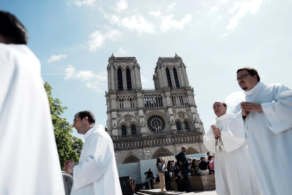 Prelates attend the Way of the Cross ceremony as part of the Holy Easter celebration, on the forecourt of Notre Dame Cathedral, in Paris, Friday, April 15, 2022. (AP Photo/Thibault Camus)