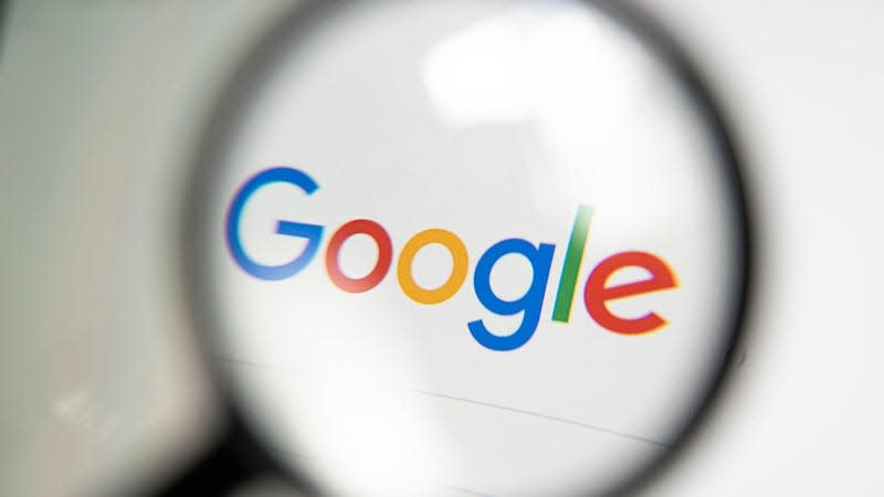 Stock photo of Google logo under magnifying glass