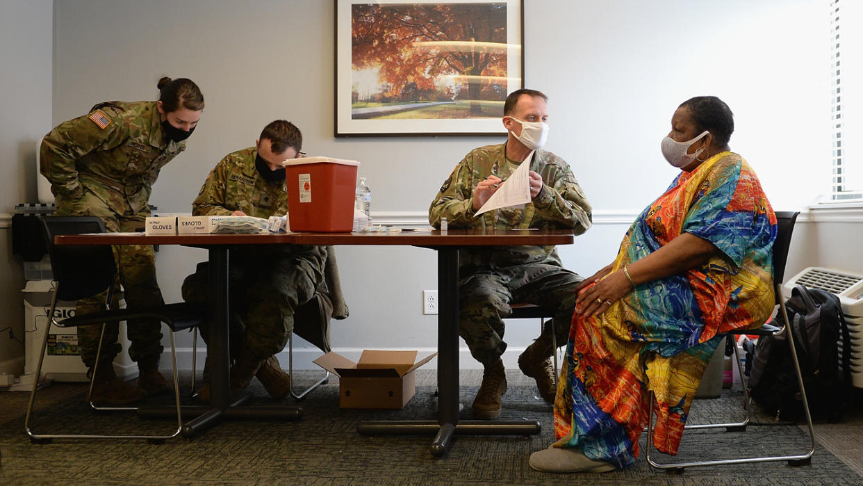 Members of the Missouri National Guard work to administer the Covid-19 vaccine during a vaccination event on February 11, 2021 at the Jeff Vander Lou Senior living facility in St Louis, Missouri. (Michael Thomas/Getty Images)