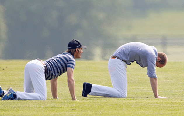 Prince William does yoga stretches before his Polo match. Photo: Getty Images