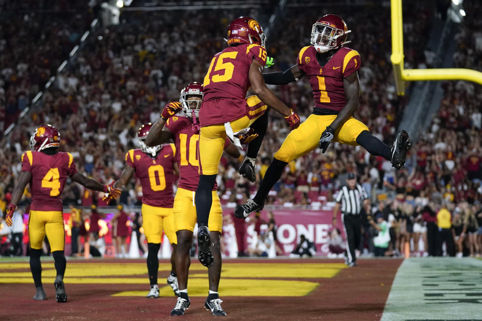 Southern California wide receiver Dorian Singer (15) and wide receiver Zachariah Branch (1) celebrate after a touchdown during the first half of an NCAA college football game against Stanford in Los Angeles, Saturday, Sept. 9, 2023. (AP Photo/Ashley Landis)