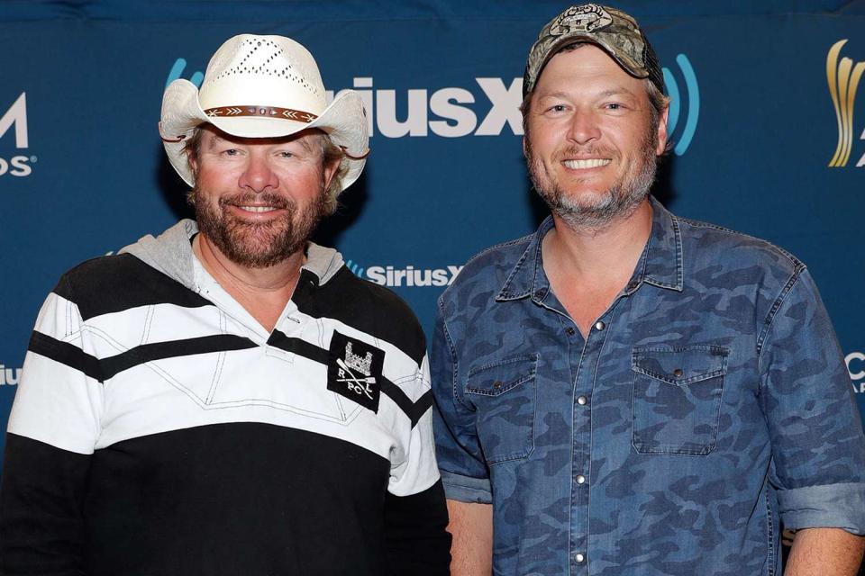 <p>Isaac Brekken/Getty</p> Toby Keith and Blake Shelton in April 2018 in Las Vegas