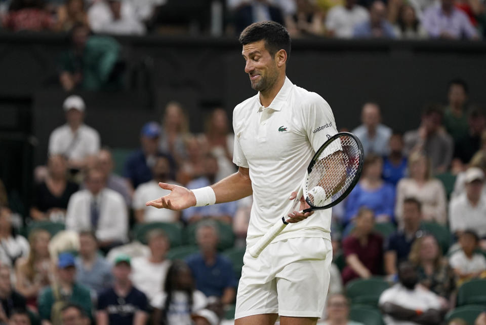 Serbia's Novak Djokovic gestures as he plays Switzerland's Stan Wawrinka in a men's singles match on day five of the Wimbledon tennis championships in London, Friday, July 7, 2023. (AP Photo/Alberto Pezzali)