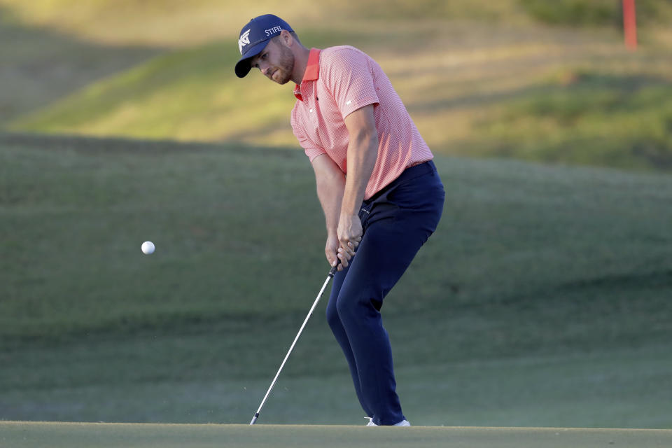 Wyndham Clark chips onto the second green during the first round of the Houston Open golf tournament Thursday, Nov. 11, 2021, in Houston. (AP Photo/Michael Wyke)