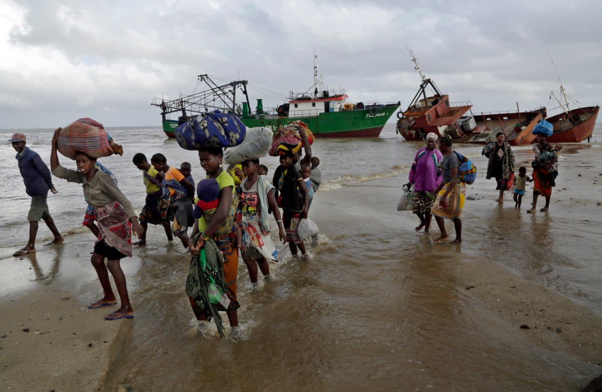 Displaced families arrive after being rescued by boat from a flooded area of Buzi district, 200 kilometers (120 miles) outside Beira, Mozambique (AP)