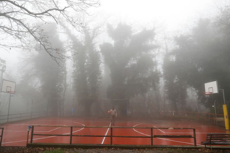 Kobe Bryant's childhood friend Michele Rotella walks in the basketball court where Kobe Bryant used to play when he was young, in Cireglio