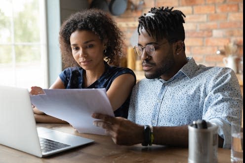 <span class="caption">If you plan for retirement now, you'll have less of a shock waiting for you in future. </span> <span class="attribution"><a class="link " href="https://www.shutterstock.com/image-photo/serious-millennial-black-married-couple-reading-2029044401" rel="nofollow noopener" target="_blank" data-ylk="slk:fizkes/Shutterstock;elm:context_link;itc:0;sec:content-canvas">fizkes/Shutterstock</a></span>