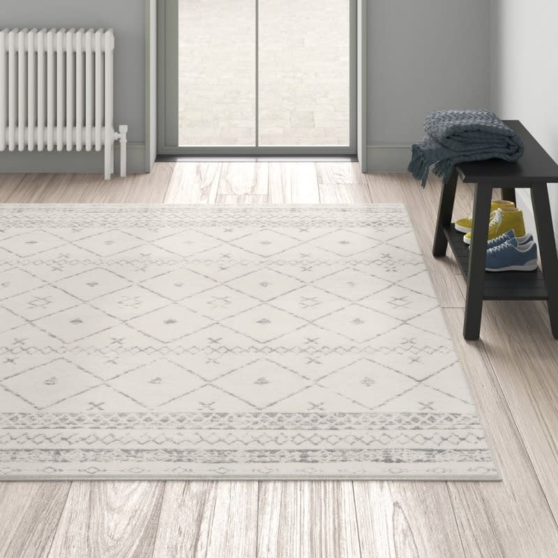 the neutral rug on a floor