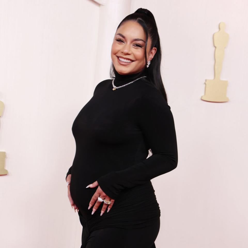 Glowing Vanessa Hudgens debuts baby bump at Oscars – first photos