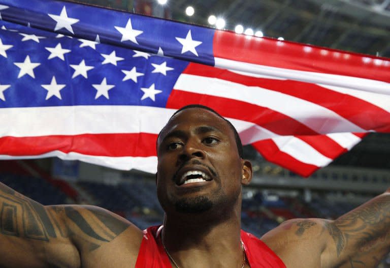 US's David Oliver reacts after winning the men's 110 metres hurdles final at the 2013 IAAF World Championships at the Luzhniki stadium in Moscow on August 12, 2013