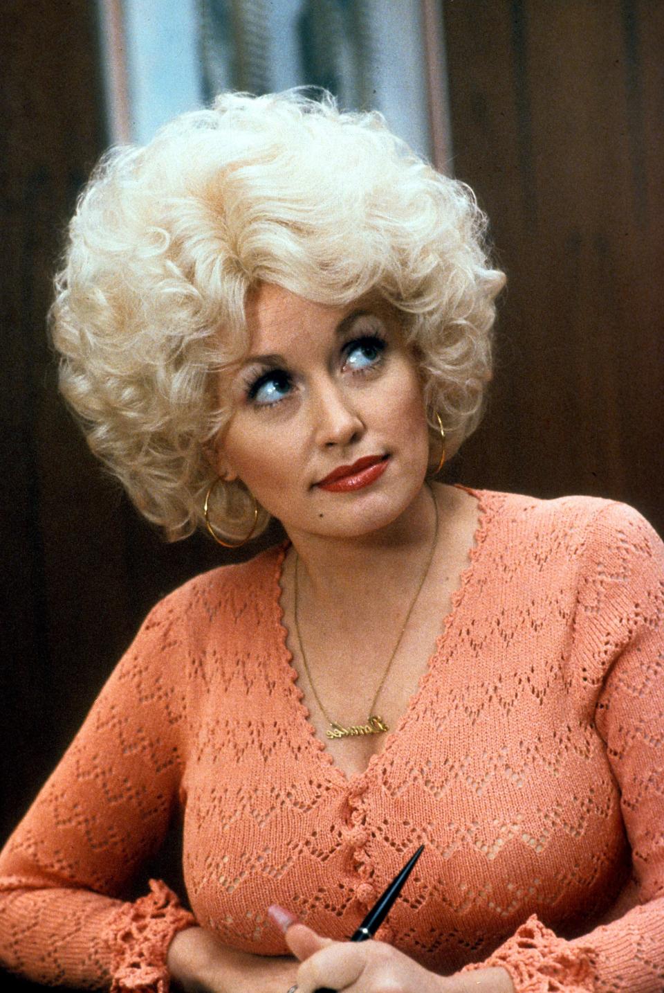 Dolly Parton in a scene from the film 'Nine To Five', 1980. (Photo by 20th Century-Fox/Getty Images)