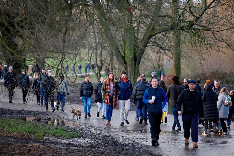 <p>Members of the public enjoy a stroll in Hampstead Heath on London on December 27, 2020</p>AFP via Getty Images