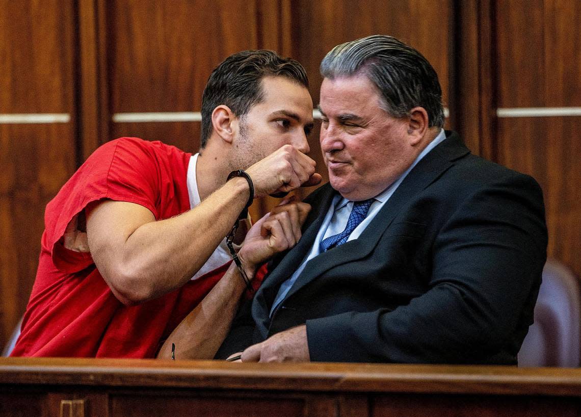 Defense attorney, Michael Pizzi chats with Hialeah Police officer Rafael Otano, during the fifth day of his bail hearing in front of Judge Robert T. Watson. He is accused of kidnapping a homeless man, driving him to an isolated location, and beating him while he was handcuffed and leaving him behind unconscious. The hearing took place at the at the Richard E. Gerstein Justice Building, in Miami, on Friday February 10, 2023.