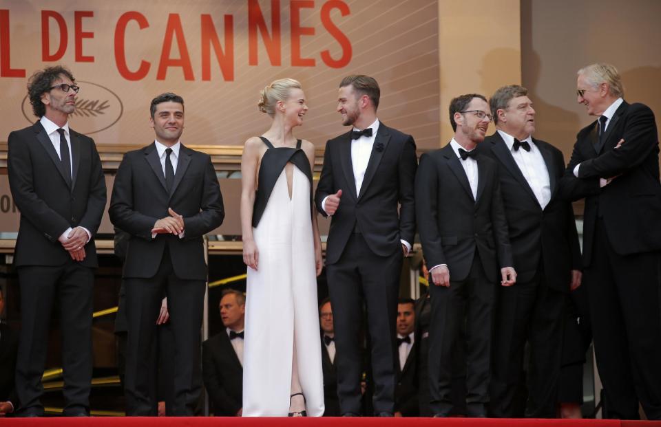 From left, director Joel Coen, actors Oscar Isaac, Carey Mulligan, Justin Timberlake, director Ethan Coen, actor John Goodman and musician T-Bone Burnett arrive for the screening of the film Inside Llewyn Davis at the 66th international film festival, in Cannes, southern France, Sunday, May 19, 2013. (AP Photo/Lionel Cironneau)