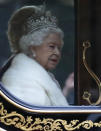 Britain's Queen Elizabeth II travels in a carriage to parliament for the official State Opening of Parliament in London, Monday, Oct. 14, 2019. (AP Photo/Frank Augstein)