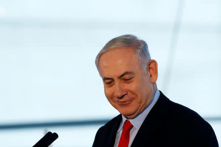 Israeli Prime Minister Benjamin Netanyahu speaks during the dedication ceremony of a new concourse at the Ben Gurion International Airport, near Lod, Israel February 15, 2018. REUTERS/Ronen Zvulun
