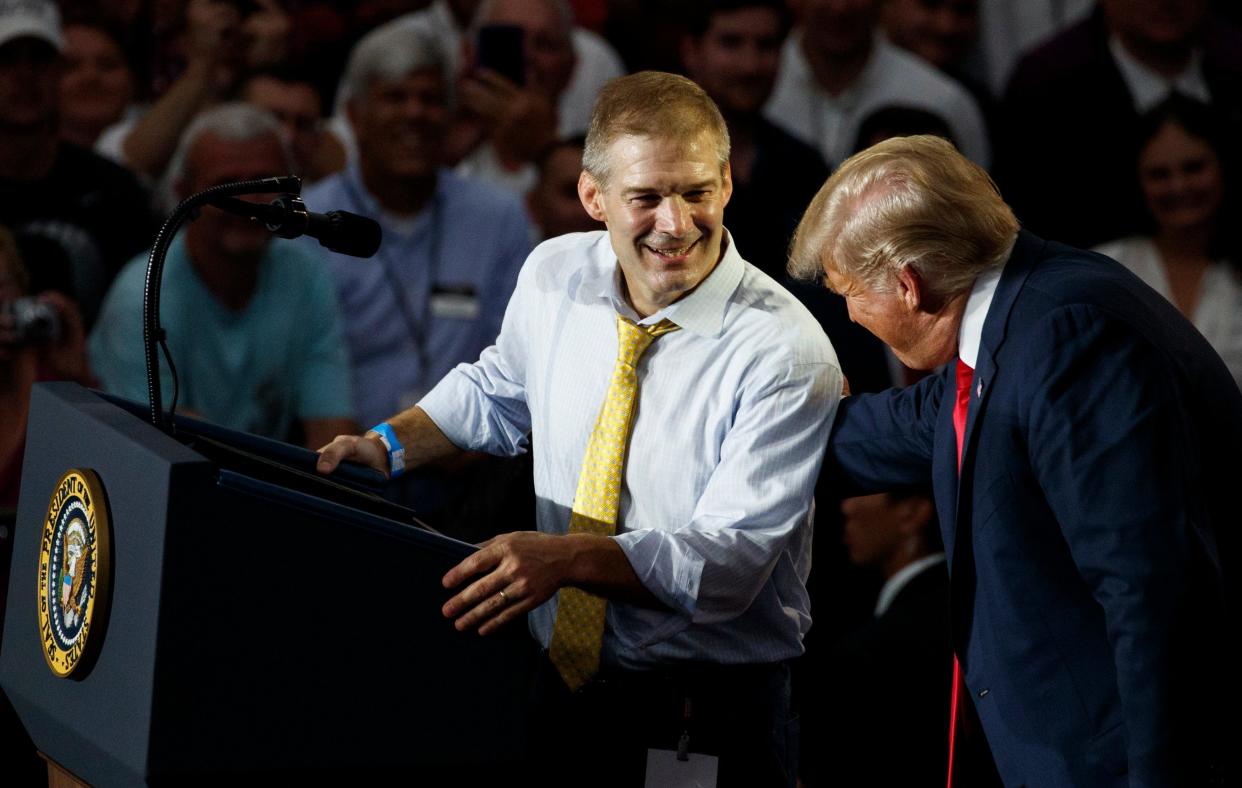 Rep. Jim Jordan, R-Ohio, looks to President Donald Trump as he speaks at a rally at Olentangy Orange High School in Lewis Center, Ohio, Saturday, Aug. 4, 2018.