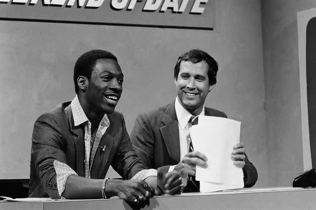 <p>Fred Hermansky/NBCU Photo Bank/NBCUniversal via Getty</p> Eddie Murphy (left) and Chevy Chase on 'Saturday Night Live' in April 1981