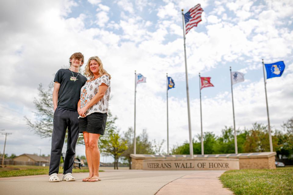 Ashley Sylvester and son Jacob Sylvester are pictured April 14 at Veterans Memorial Park in Moore. Her late husband is listed there on the Veterans Wall of Honor.