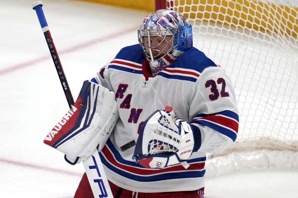 New York Rangers goaltender Jonathan Quick stops a shot during the first period of an NHL hockey game against the Pittsburgh Penguins in Pittsburgh, Wednesday, Nov. 22, 2023. (AP Photo/Gene J. Puskar)