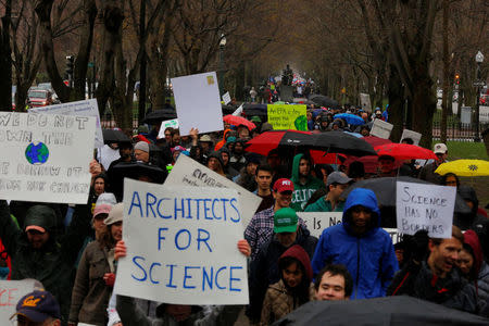 Demonstrators march down Commonwealth Avenue from Massachusetts Institute of Technology (MIT) to the March for Science rally on the Common in Boston, Massachusetts, U.S., April 22, 2017. REUTERS/Brian Snyder