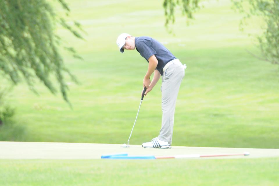 Sacred Heart's Hunter Newell prepares to make a putt during the Class 2A state golf championships Monday, May 23 2022 at Emporia Municipal Golf Course.