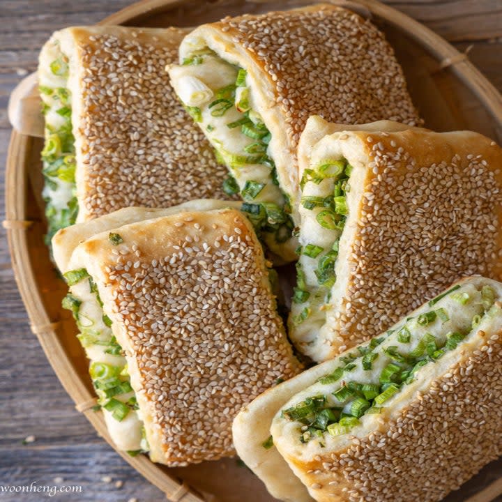 bread with sesame seeds on the outside and scallions on the inside
