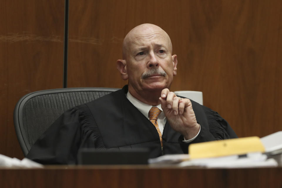 Judge Larry P. Fidler listens to closing arguments in the trial of People vs. Michael Gargiulo Tuesday, Aug. 6, 2019, in Los Angeles. Closing arguments started Tuesday in the trial of an air conditioning repairman charged with killing two Southern California women and attempting to kill a third. (Lucy Nicholson, Pool Photo via AP)