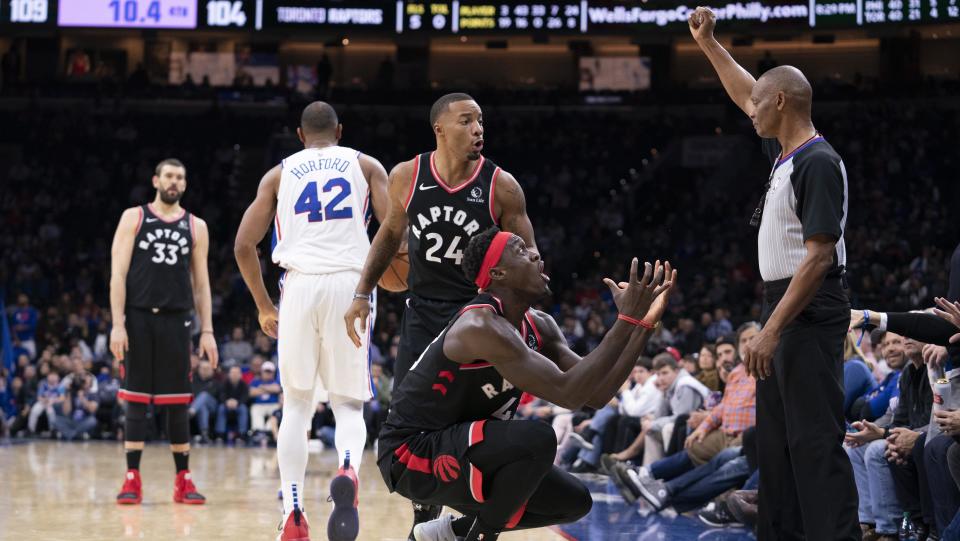 PHILADELPHIA, PA - DECEMBER 08: Pascal Siakam #43 and Norman Powell #24 of the Toronto Raptors react to a call made by referee Michael Smith #38 in the fourth quarter against the Philadelphia 76ers at Wells Fargo Center on December 8, 2019 in Philadelphia, Pennsylvania. The 76ers defeated the Raptors 110-104. NOTE TO USER: User expressly acknowledges and agrees that, by downloading and/or using this photograph, user is consenting to the terms and conditions of the Getty Images License Agreement. (Photo by Mitchell Leff/Getty Images)