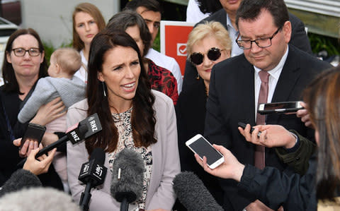 Jacinda Ardern speaks with the media during a visit to a medical centre on the Labour Party's campaign trail in Wellington on September 19, 2017 - Credit: MARTY MELVILLE/AFP