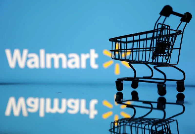 Walmart cuts profit forecast, points to food and fuel inflation